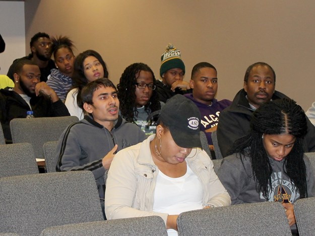Exchange student Naveed Khan-center-asking question.jpg