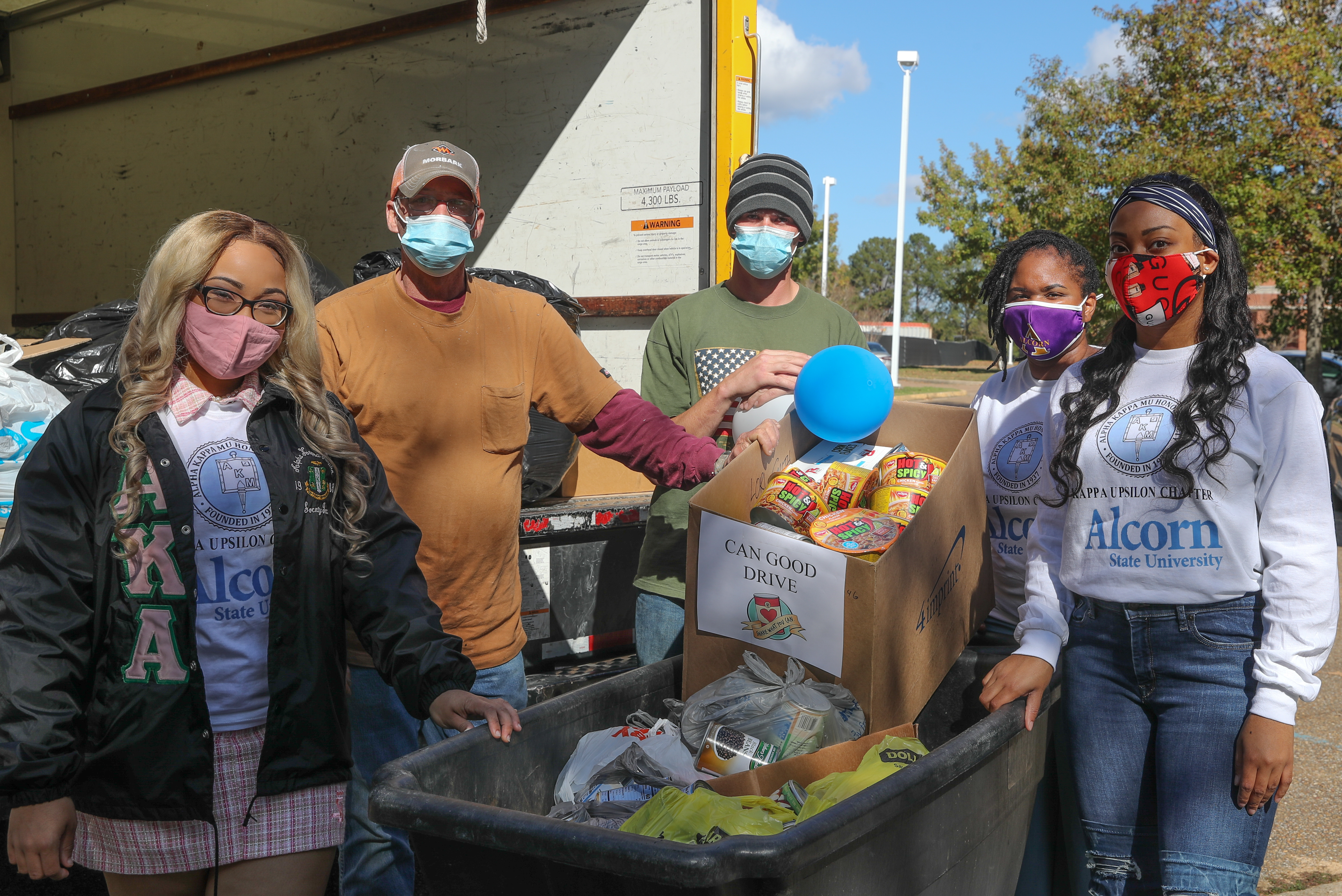 Members of Alpha Kappa Mu Honor Society participating in community service