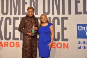 Manola Erby receiving award.