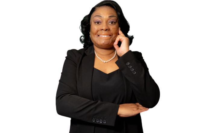 Dr. Tanea Fisher wearing black blouse and blazer in professional headshot.