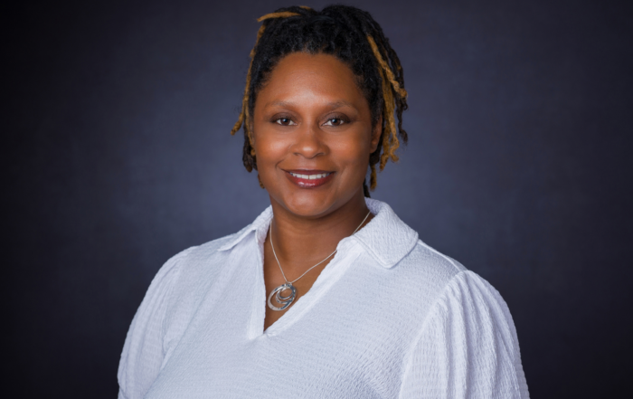 Jarita King professional headshot wearing a white blouse.