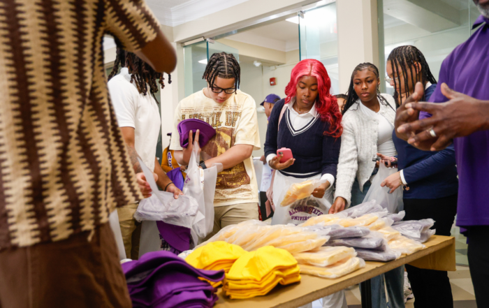 high school students looking at alcorn gear