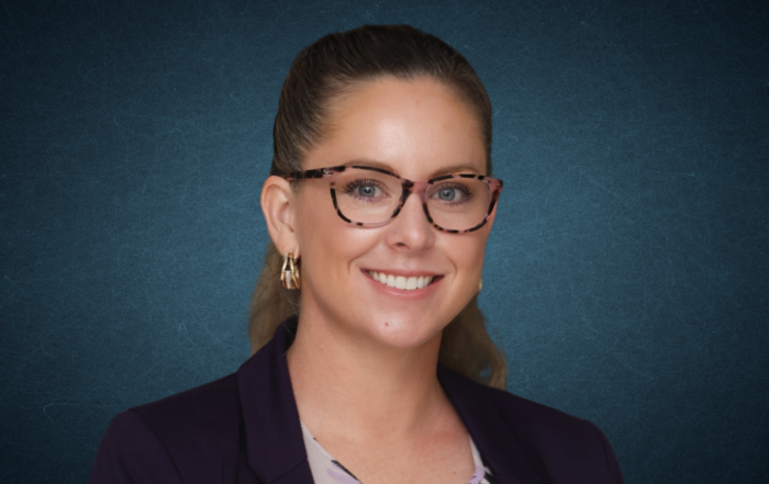Dr. Melissa Mason-Montgomery, associate director of Extension at Alcorn State University, smiling in a dark purple blazer over a floral top.