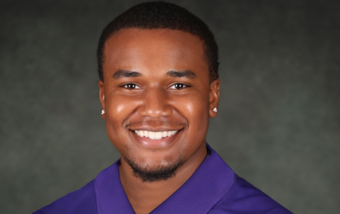 Donovan Shoemaker, Alcorn State University senior animal science major, smiling in a purple polo shirt